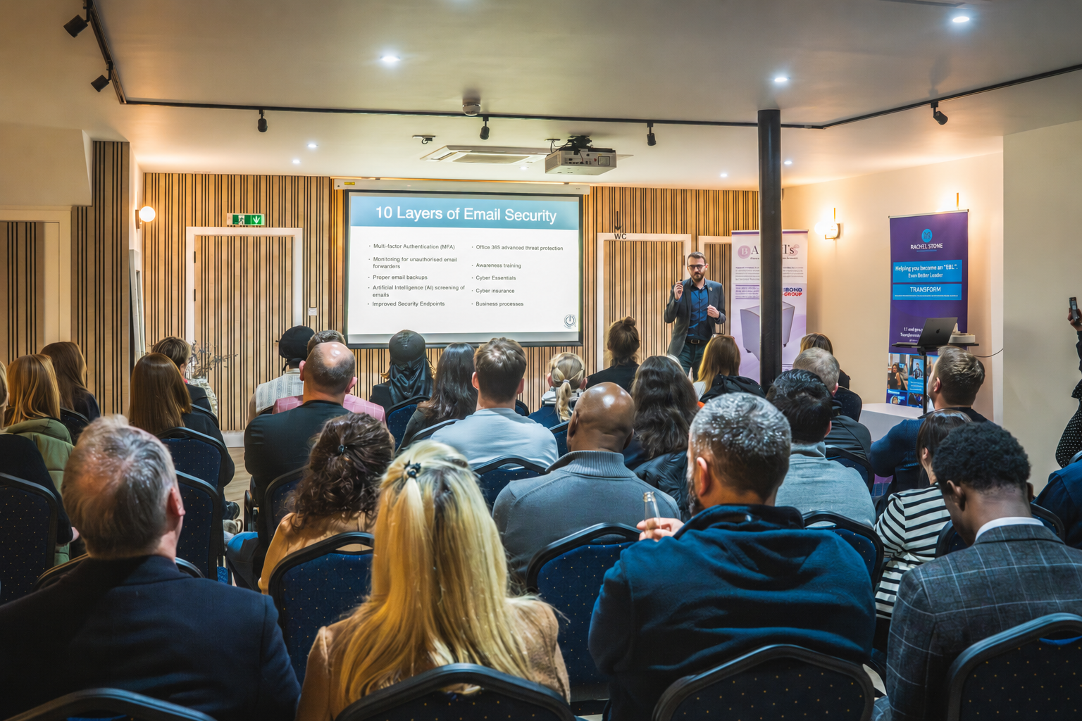 Tom Reveley speaking to a business audience about email security.